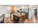 Modern kitchen features white cabinets, butcher block counters, and a kitchen island with seating at 2286 S Pitkin Way # A, Aurora, CO 80013
