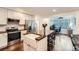 Kitchen with a breakfast bar, stainless steel appliances, and a connected office space at 2286 S Pitkin Way # A, Aurora, CO 80013