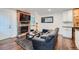 Cozy living room with a stone fireplace and white cabinets, offering a warm and inviting space at 2286 S Pitkin Way # A, Aurora, CO 80013