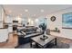 Spacious open floor plan joining the kitchen and living room areas with a workspace nearby at 2286 S Pitkin Way # A, Aurora, CO 80013