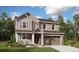 Charming two-story home features a covered porch, stone accents, and an attached two-car garage at 39141 Anthony St, Elizabeth, CO 80107