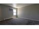 Bright bedroom featuring an air conditioning unit and large window at 10150 E Virginia Ave # 308, Denver, CO 80247