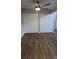 Bedroom with wood-look floors and a spacious closet at 10150 E Virginia Ave # 308, Denver, CO 80247