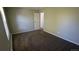 Cozy bedroom with a neutral color scheme and an open door at 10150 E Virginia Ave # 308, Denver, CO 80247