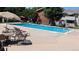 Community pool with lounging area for residents to cool off and enjoy the summer at 10150 E Virginia Ave # 308, Denver, CO 80247
