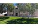 Exterior shot of building with number 19 in the center, and large trees framing the sides of the building at 10150 E Virginia Ave # 308, Denver, CO 80247