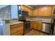 The updated kitchen features stainless steel appliances, modern cabinets, and sleek countertops at 10150 E Virginia Ave # 308, Denver, CO 80247