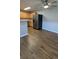 Spacious kitchen features stainless steel refrigerator and wood-look flooring at 10150 E Virginia Ave # 308, Denver, CO 80247
