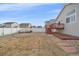 Backyard features a patio, landscaping and deck access at 2420 Nicholson St, Berthoud, CO 80513