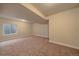 Finished basement room with neutral walls and carpet, plus a window at 2420 Nicholson St, Berthoud, CO 80513