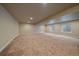 Spacious finished basement with neutral carpet and recessed lighting at 2420 Nicholson St, Berthoud, CO 80513