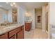 Bathroom with granite vanity, shower and soaking tub at 2420 Nicholson St, Berthoud, CO 80513