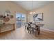 Bright dining area with hardwood floors and access to deck at 2420 Nicholson St, Berthoud, CO 80513