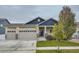 Two-story home with a two-car garage and landscaped yard at 2420 Nicholson St, Berthoud, CO 80513
