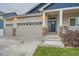 Two-car garage and welcoming front porch at 2420 Nicholson St, Berthoud, CO 80513