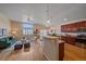 Open concept kitchen with hardwood floors, granite counters, and stainless steel appliances at 2420 Nicholson St, Berthoud, CO 80513