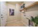 Laundry room with shelving, and a hook for hanging clothes at 2420 Nicholson St, Berthoud, CO 80513