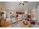 Open living room with hardwood floors, kitchen island, and seating area at 2420 Nicholson St, Berthoud, CO 80513