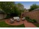 Inviting backyard with brick patio, outdoor fireplace, and comfortable seating for relaxation and entertaining at 637 N Franklin St, Denver, CO 80218