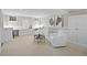 Basement features built-in shelving and two comfortable chairs in a neutral color palette at 637 N Franklin St, Denver, CO 80218