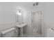 A bright bathroom features a pedestal sink, and a glass-enclosed shower at 637 N Franklin St, Denver, CO 80218