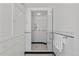 Bright bathroom featuring a glass-enclosed shower, tiled walls and built-in storage at 637 N Franklin St, Denver, CO 80218