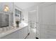 Elegant bathroom featuring marble countertops, double sinks and lots of natural light at 637 N Franklin St, Denver, CO 80218