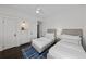 Bright bedroom featuring two twin beds, hardwood floors and custom built in closet at 637 N Franklin St, Denver, CO 80218