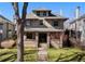 Charming two-story home with mature landscaping and inviting front entrance at 637 N Franklin St, Denver, CO 80218