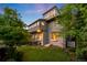 Back of home featuring many windows and mature trees at 637 N Franklin St, Denver, CO 80218