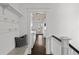 Hallway with dark hardwood floors leads to the kitchen at 637 N Franklin St, Denver, CO 80218