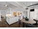 Bright kitchen with white cabinets, granite countertops, subway tile backsplash and a casual eat-in breakfast area at 637 N Franklin St, Denver, CO 80218