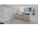 Bright living room with built-in storage, a modern sofa, fireplace, and large windows at 637 N Franklin St, Denver, CO 80218