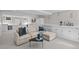 Basement living room with comfortable sectional, built-in storage, and modern decor at 637 N Franklin St, Denver, CO 80218
