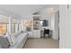 Bright sun room with built-in bench seating, desk area, and many windows at 637 N Franklin St, Denver, CO 80218