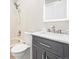 Bright bathroom with a shower and tub combination and a marble countertop vanity at 2578 E Nichols Cir, Centennial, CO 80122