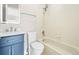 Well-lit bathroom with vanity, shower, and tub combination for a relaxing experience at 2578 E Nichols Cir, Centennial, CO 80122