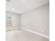 An empty bedroom with white floors and a window at 2578 E Nichols Cir, Centennial, CO 80122
