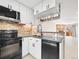 Updated kitchen features stainless steel appliances and a brick backsplash at 2578 E Nichols Cir, Centennial, CO 80122