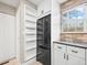 Kitchen featuring stainless steel refrigerator, storage, and a window offering natural light at 2578 E Nichols Cir, Centennial, CO 80122