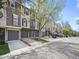 Charming townhomes with attached garages line the street, displaying varied exterior finishes and appealing features at 2578 E Nichols Cir, Centennial, CO 80122