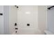 Clean, bright bathroom showcasing an updated tiled shower and modern fixtures at 2090 S Fairplay St, Aurora, CO 80014