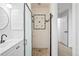 Remodeled bathroom featuring a glass shower, updated vanity, and neutral walls at 2090 S Fairplay St, Aurora, CO 80014