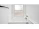Bathroom with white tiled bathtub and neutral walls at 2090 S Fairplay St, Aurora, CO 80014