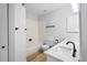 Bright bathroom featuring a white tub, light countertops, and modern fixtures at 2090 S Fairplay St, Aurora, CO 80014