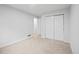 Bright bedroom features neutral carpet, white walls, and a closet at 2090 S Fairplay St, Aurora, CO 80014