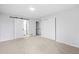 Bedroom features neutral walls and carpet, a closet, and ensuite bath at 2090 S Fairplay St, Aurora, CO 80014