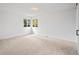 Sun-filled bedroom boasts neutral walls and carpet, plus large windows at 2090 S Fairplay St, Aurora, CO 80014