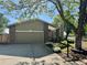 Lovely home featuring an attached garage and a well-maintained lawn at 2090 S Fairplay St, Aurora, CO 80014