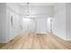 Bright entryway with sleek floors, closet storage, and staircase to the second floor at 2090 S Fairplay St, Aurora, CO 80014